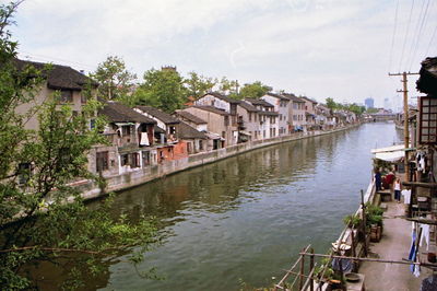 River in town against sky