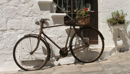 Bicycle parked against wall