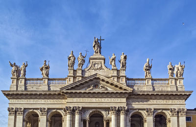 Low angle view of statue against cloudy sky