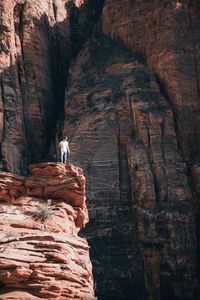 Full length of man on rock against mountain