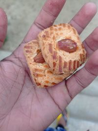 High angle view of person holding cake
