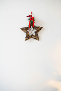 Homemade christmas star wreath on white background with copy space