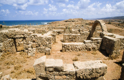 Apollonia ruins on landscape against cloudy sky