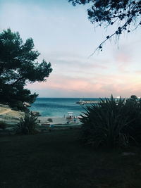Scenic view of calm sea against cloudy sky