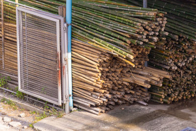 Bamboo trunk material stacks used in the construction industry.