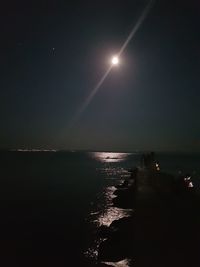 Scenic view of sea against sky at night