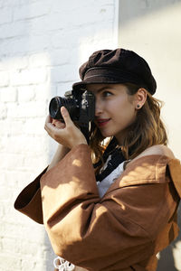 Woman photographing with camera