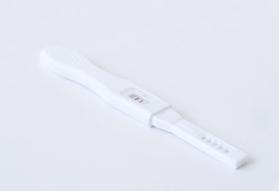 Close-up of fork over white background