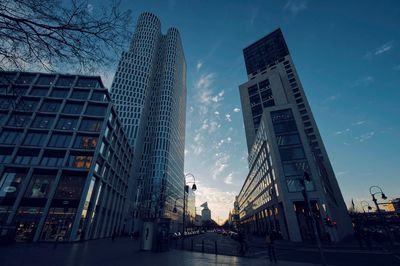 Low angle view of buildings against sky in city