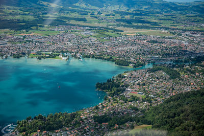 High angle view of buildings and sea in town