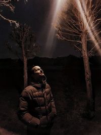 Man sitting on plant at night