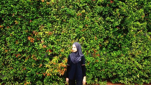 Woman standing on tree