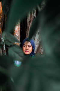 Portrait of young woman outdoors