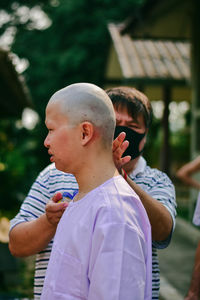 Portrait of boy standing outdoors