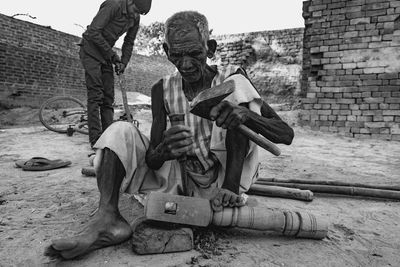 Old man trying to build a bed, old wood worker