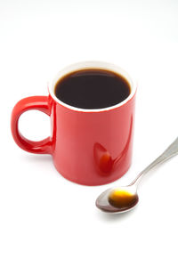 Close-up of tea cup against white background