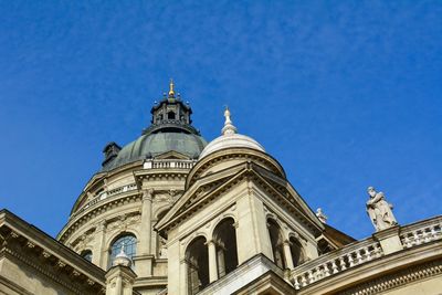 Low angle view of building against blue sky