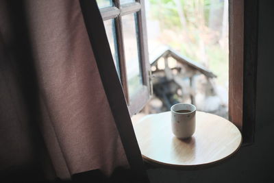 Close-up of coffee cup on table