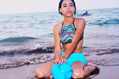 Full length of boy on beach against sky