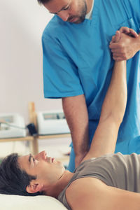 Midsection of man lying on floor