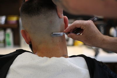 Rear view of man at barber