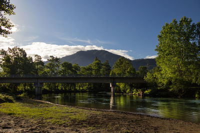 Bridge over river against sky