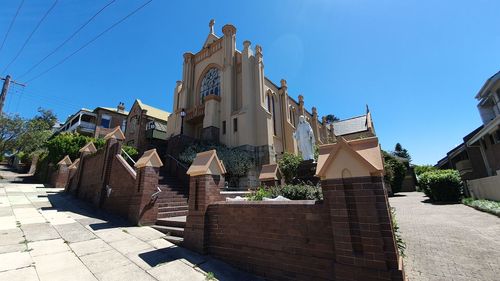 Exterior of buildings against clear blue sky