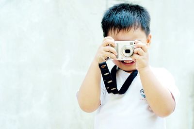 Cute boy holding baby