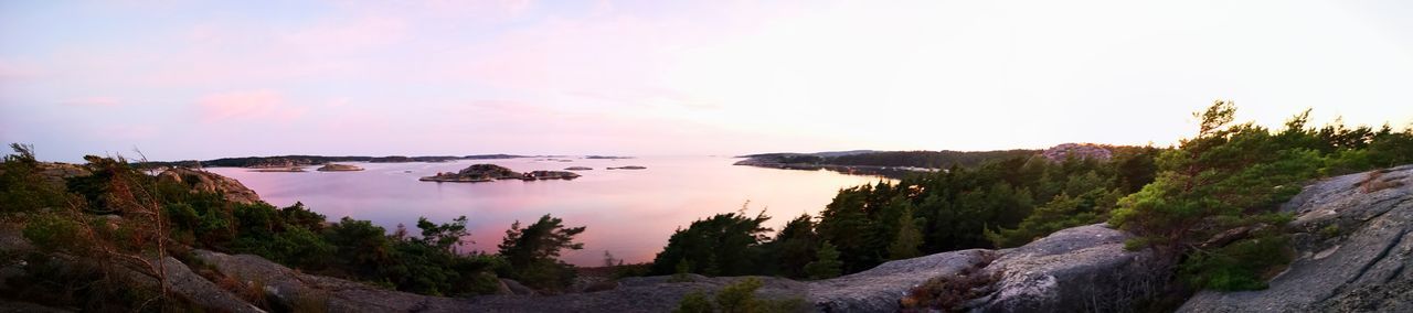 PANORAMIC SHOT OF ROCKS AGAINST SKY DURING SUNSET