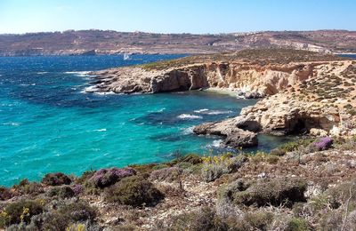 Scenic view of bay against clear sky