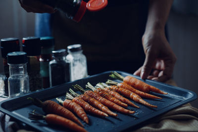 Man preparing food on barbecue grill