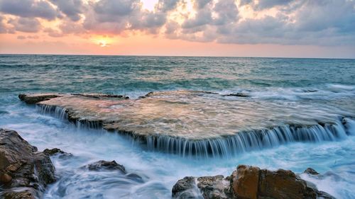 Scenic view of sea against sky during sunset