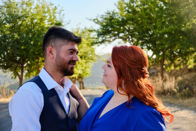 Portrait of young couple outdoors