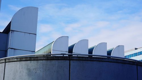 Low angle view of factory against sky