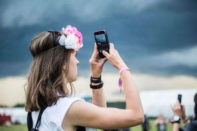 Young woman holding camera