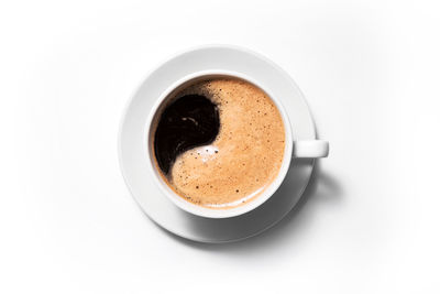 High angle view of coffee cup over white background