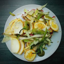 High angle view of chopped vegetables in plate on table