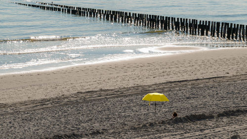 Yellow umbrella on beach