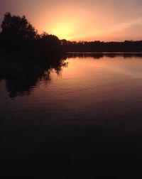 Scenic view of lake at sunset