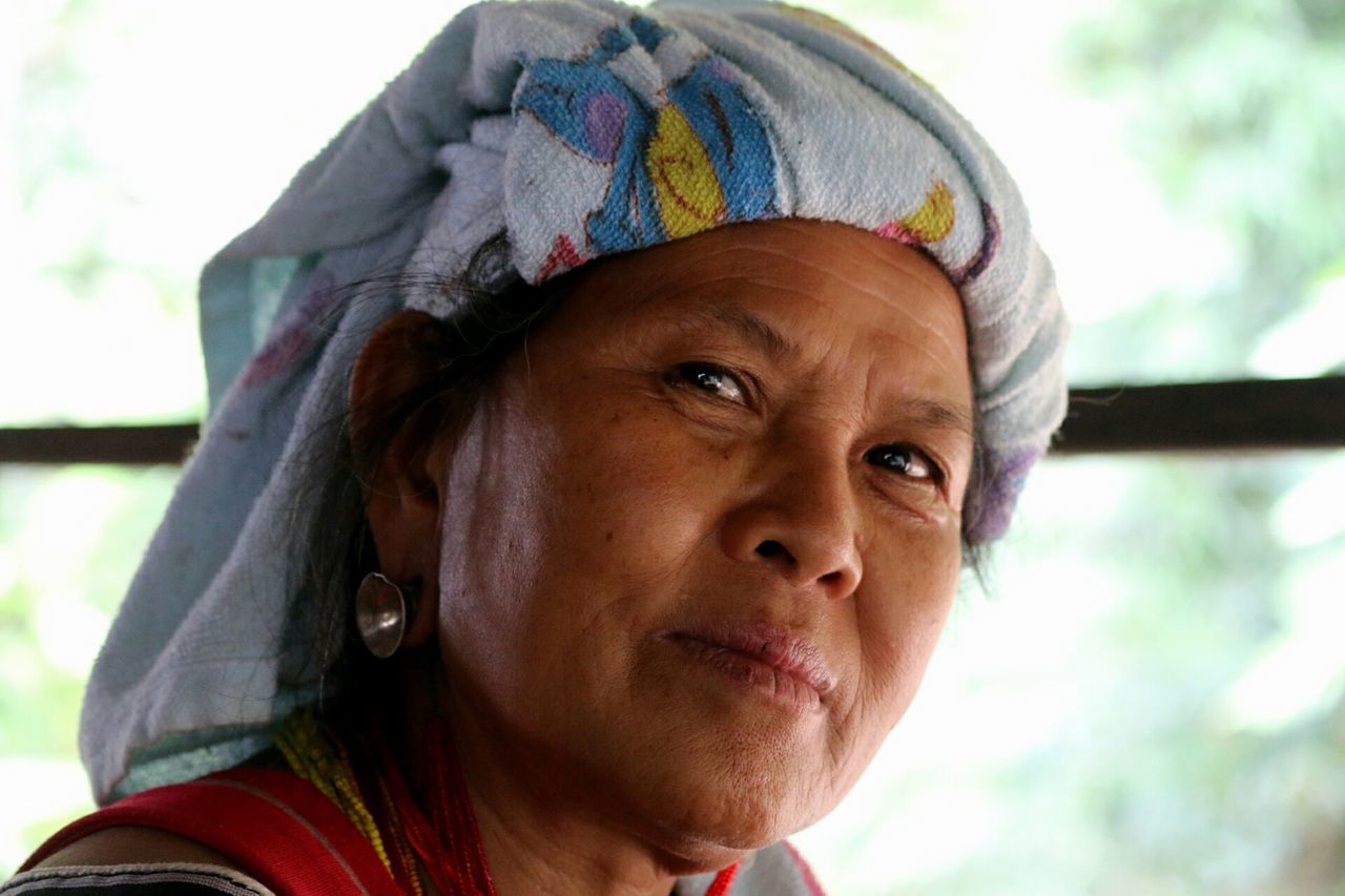 CLOSE-UP OF YOUNG WOMAN WITH HANDS