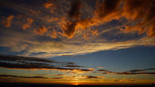 Low angle view of dramatic sky during sunset