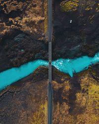 High angle view of rocks by lake