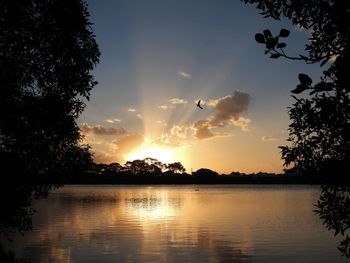 Scenic view of lake against sky during sunset