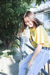 Smiling girl sitting in traditional clothing