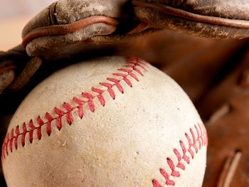 Close-up of ball and gloves