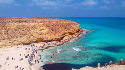 Aerial view of people at beach against sky