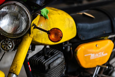 Close-up of yellow bicycle