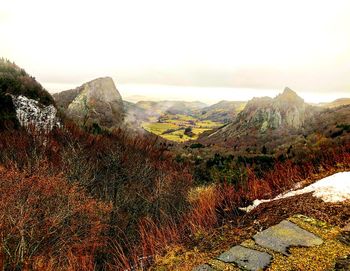 Aerial view of landscape with mountain in background