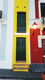 Yellow sign on wall of building