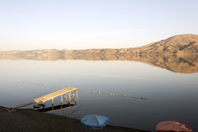 High angle view of pier on lake against sky